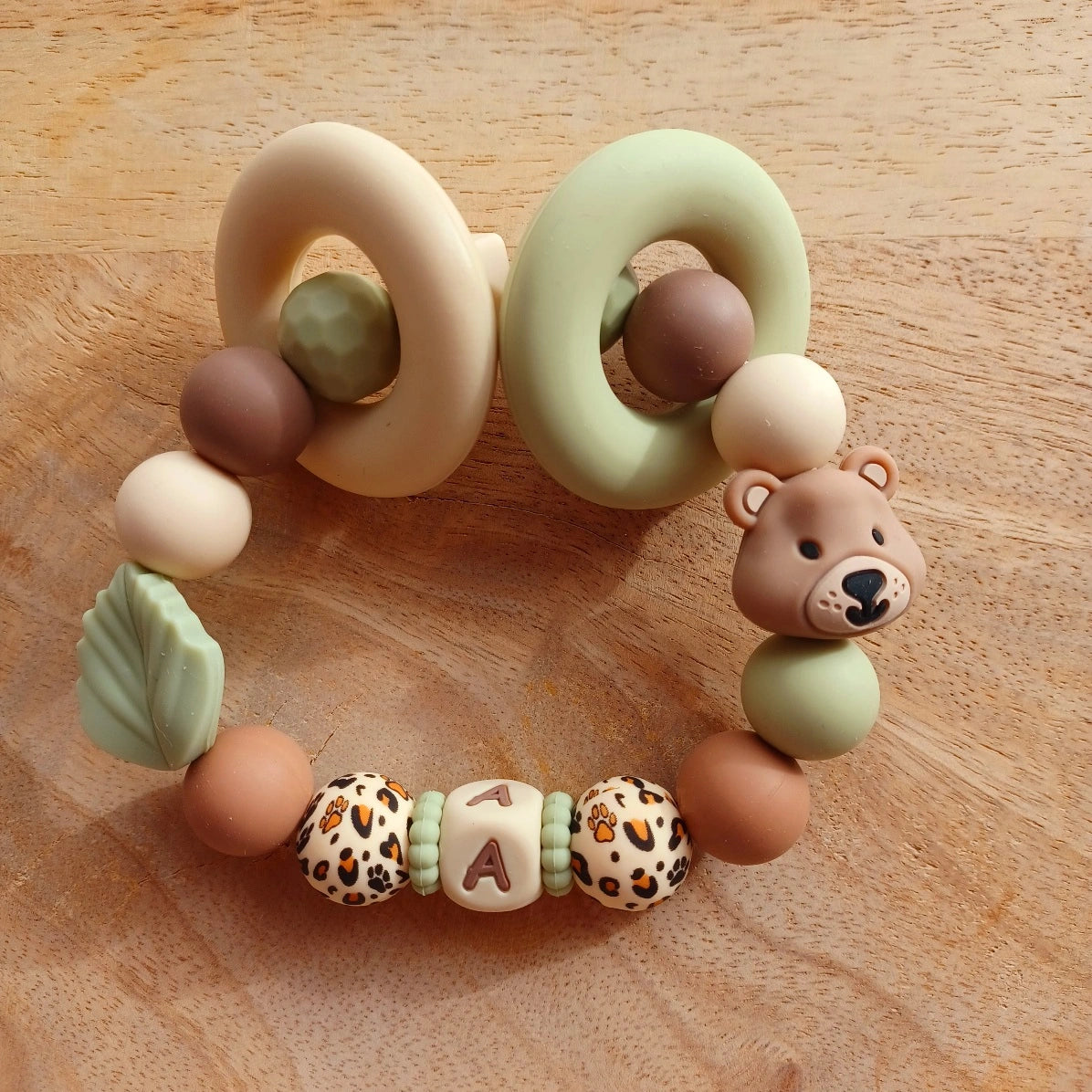 Attache tétine silicone Ours marron-vert, crème-choco. Aaron