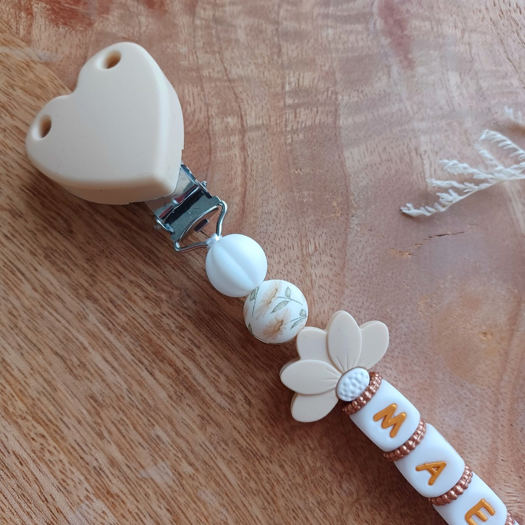 Attache tétine silicone, couleur crème, blanc, lotus. Maely
