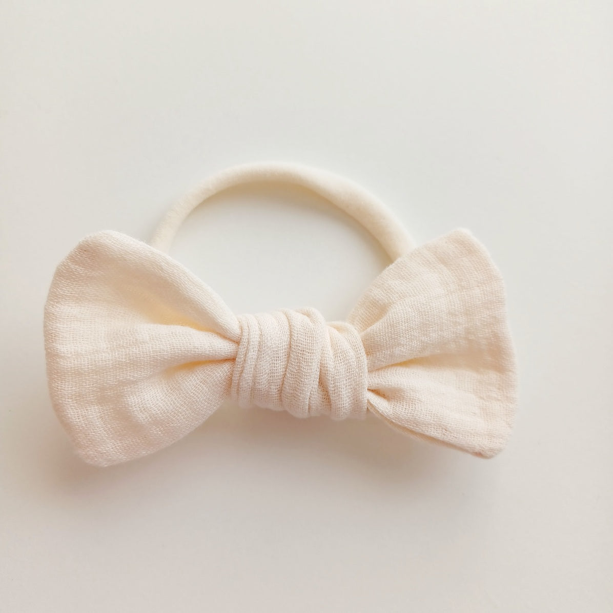 Bandeaux à noeud en gaze de coton pour bébé. Couleurs neutres