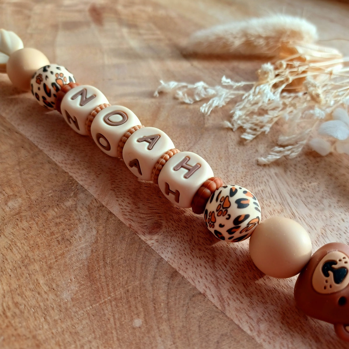 Attache tétine silicone, choco, caramel. Ours