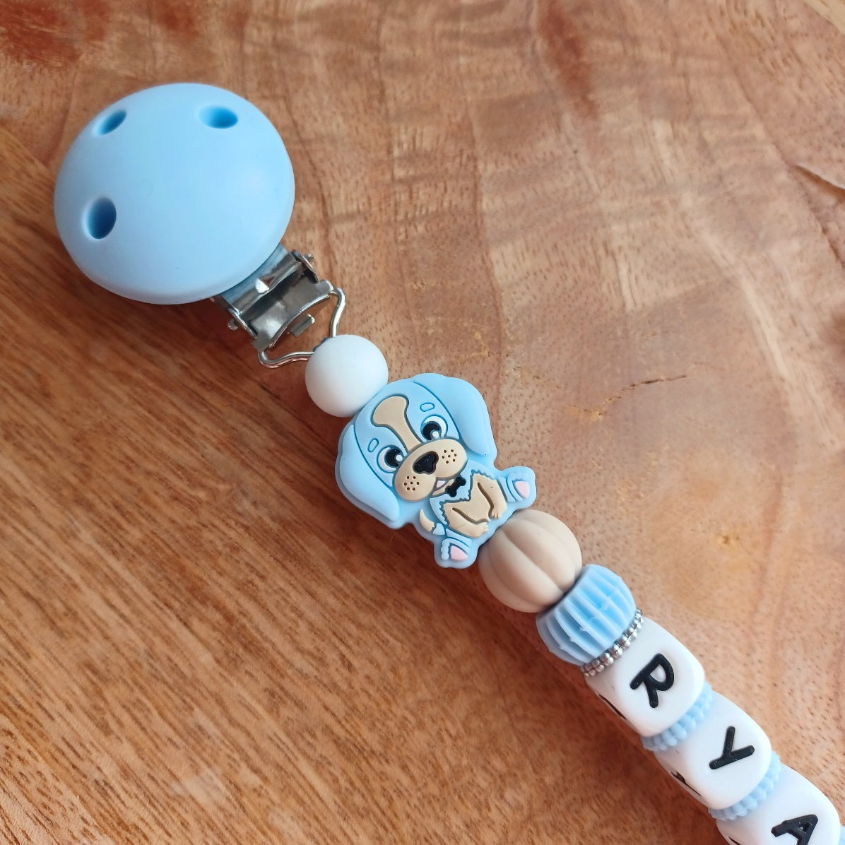 Attache tétine silicone, arc en ciel, bleu . Ryan