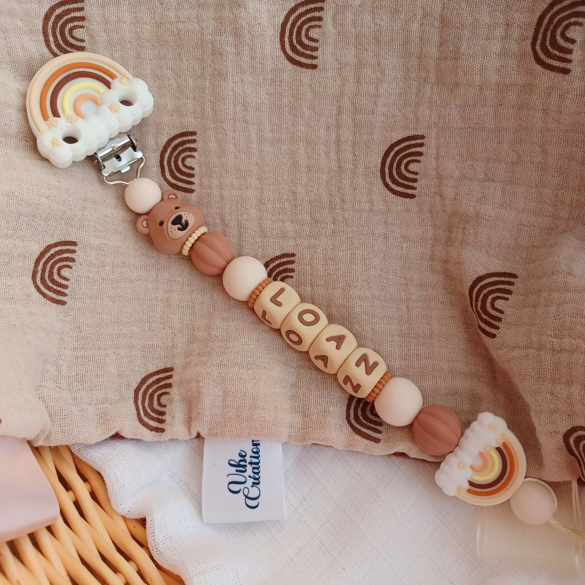 Attache tétine silicone Ours marron, crème-choco. Loan.