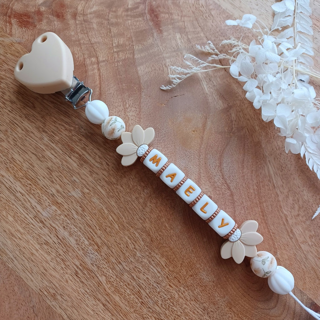 Attache tétine silicone, couleur crème, blanc, lotus. Maely