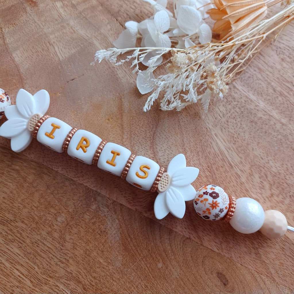 Attache tétine silicone, Fleur lotus blanc, crème. Iris