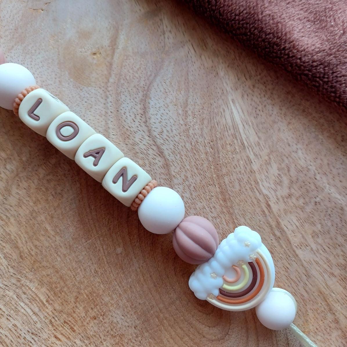 Attache tétine silicone Ours marron, crème-choco. Loan.