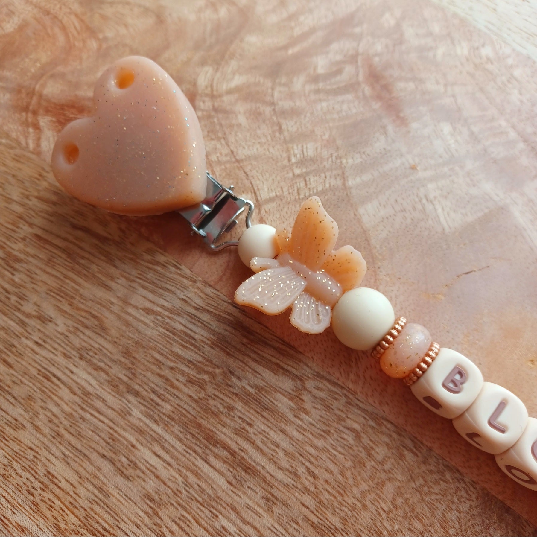 Attache tétine silicone, noeud, papillon, paillettes.