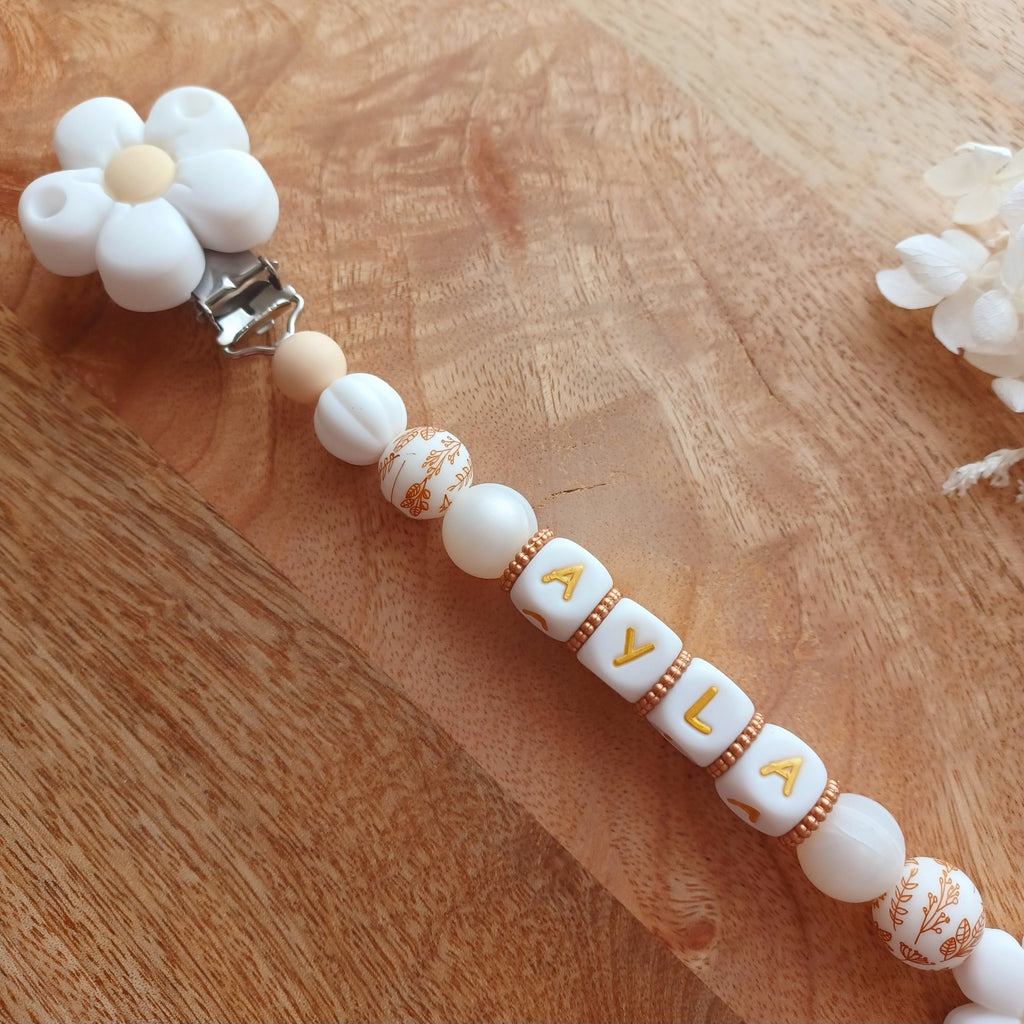Attache tétine silicone, Fleur blanc, crème. Ayla