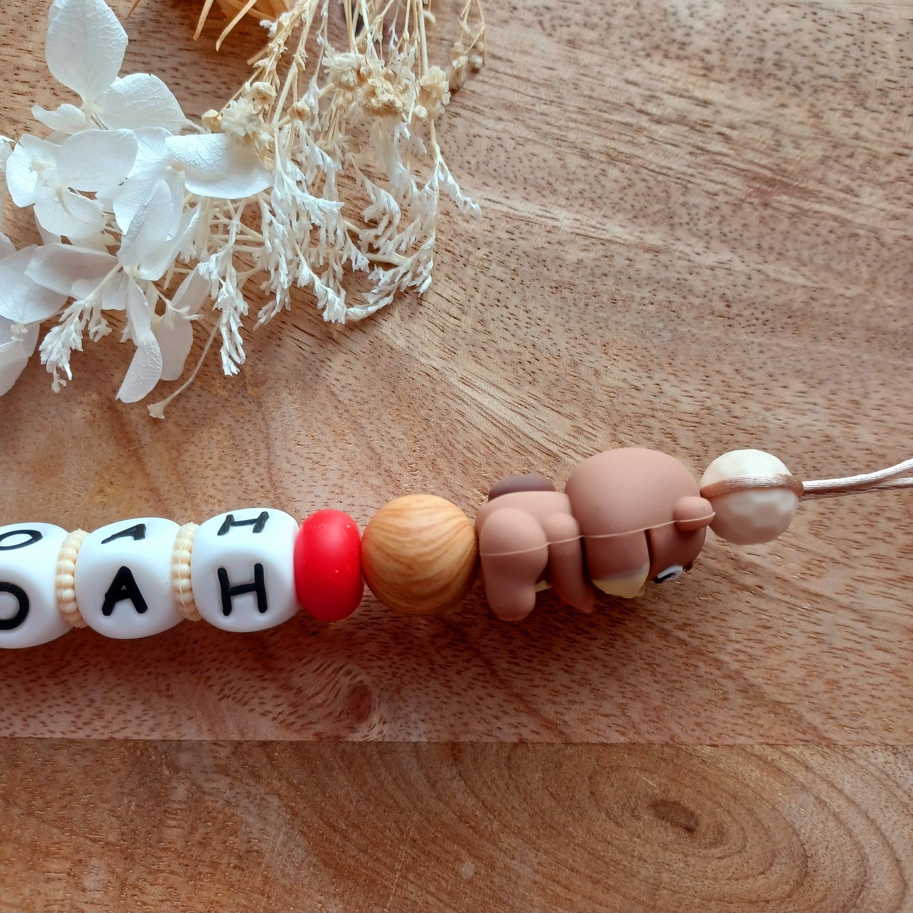 Attache tétine silicone, Castor, crème, choco. Noah