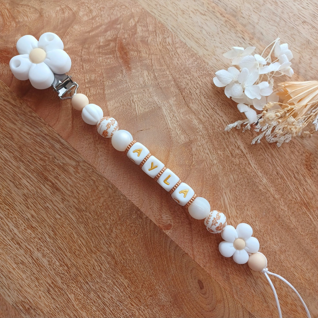 Attache tétine silicone, Fleur blanc, crème. Ayla