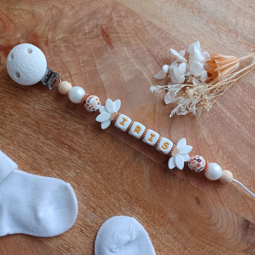 Attache tétine silicone, Fleur lotus blanc, crème. Iris