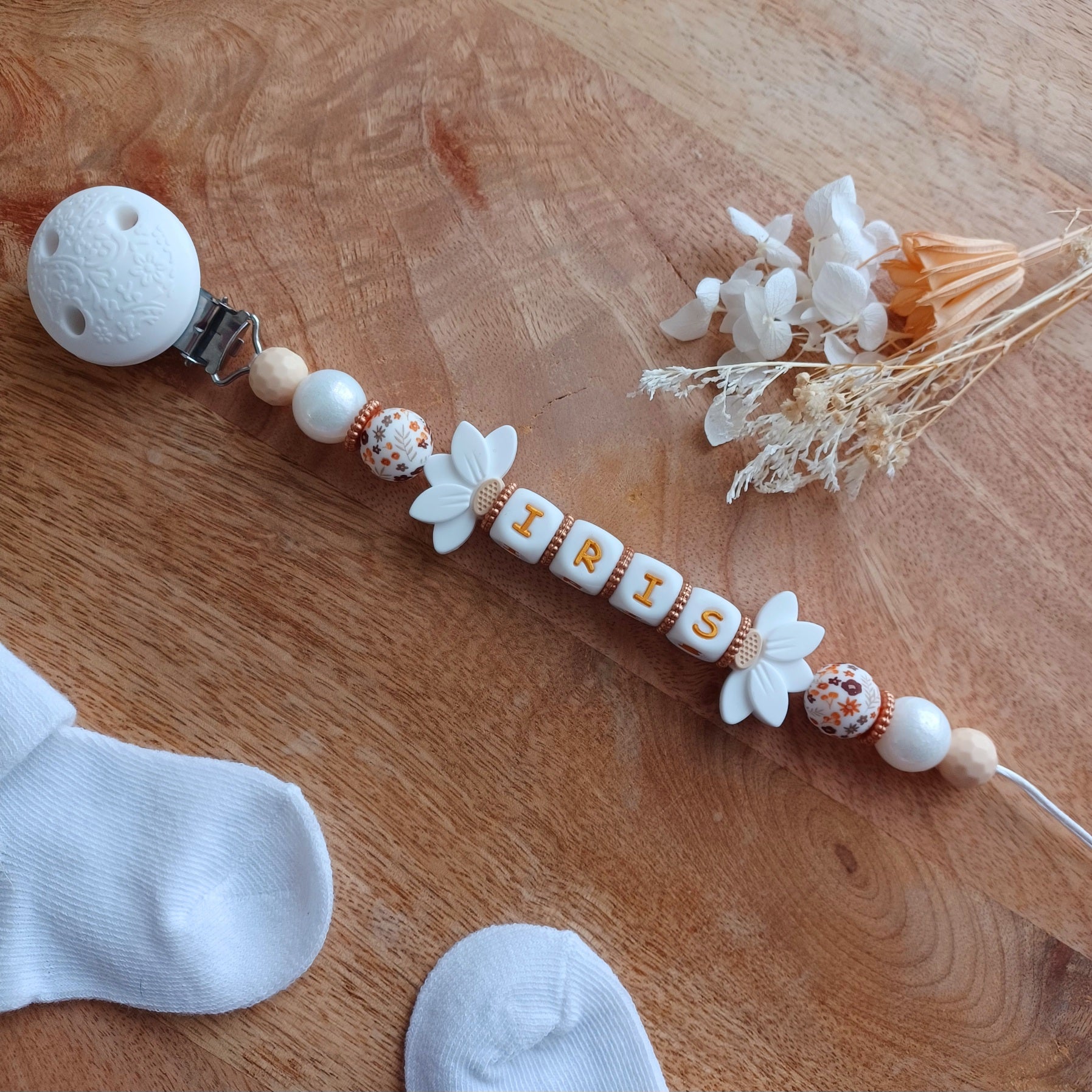 Attache tétine silicone, Fleur lotus blanc, crème. Iris