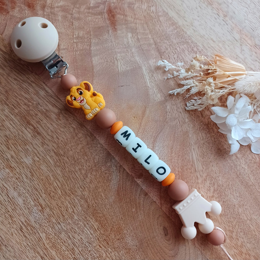 Attache tétine silicone, lion, blanc, marron, couronne. Milo