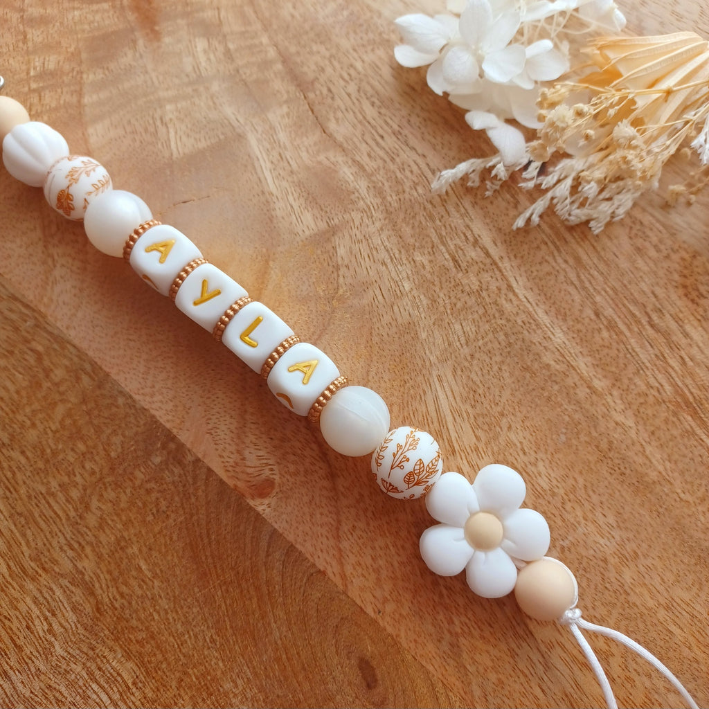 Attache tétine silicone, Fleur blanc, crème. Ayla